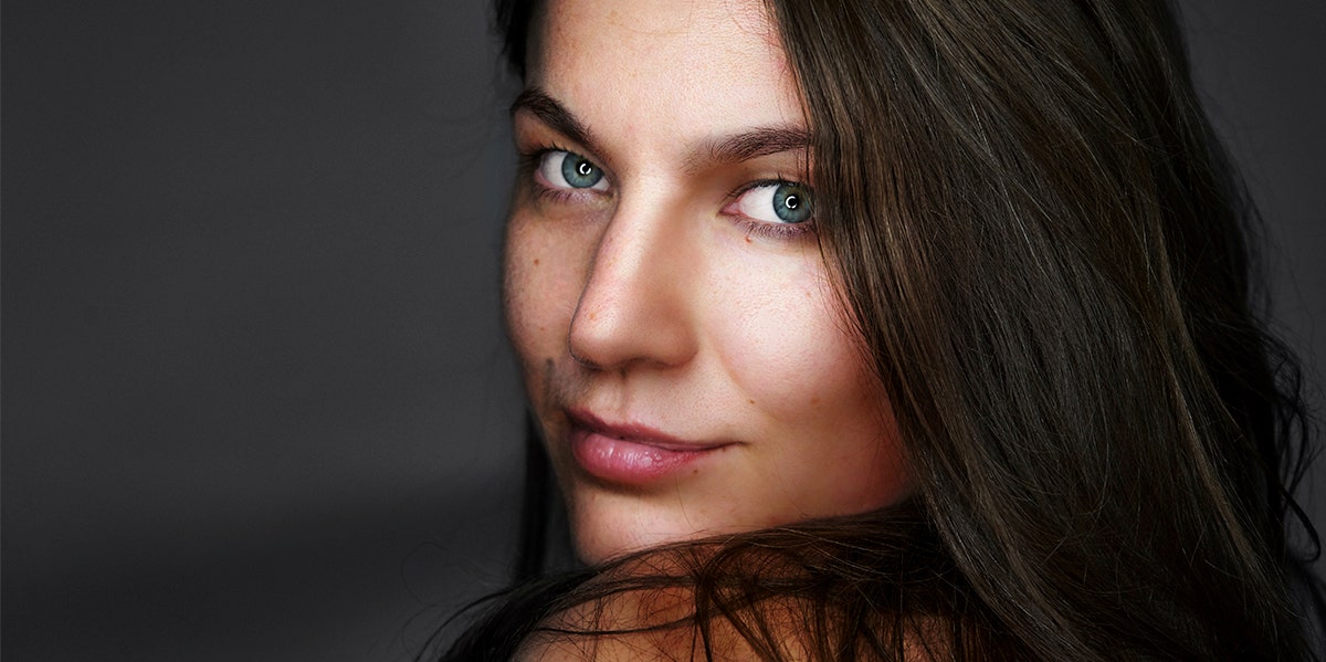 What People Notice About Your Face (That Make You Look Unhealthy) woman's face