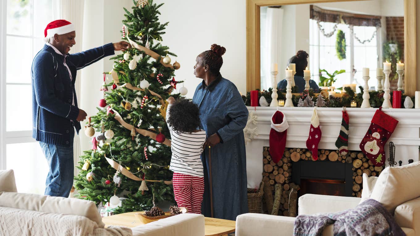 family decorating Christmas tree