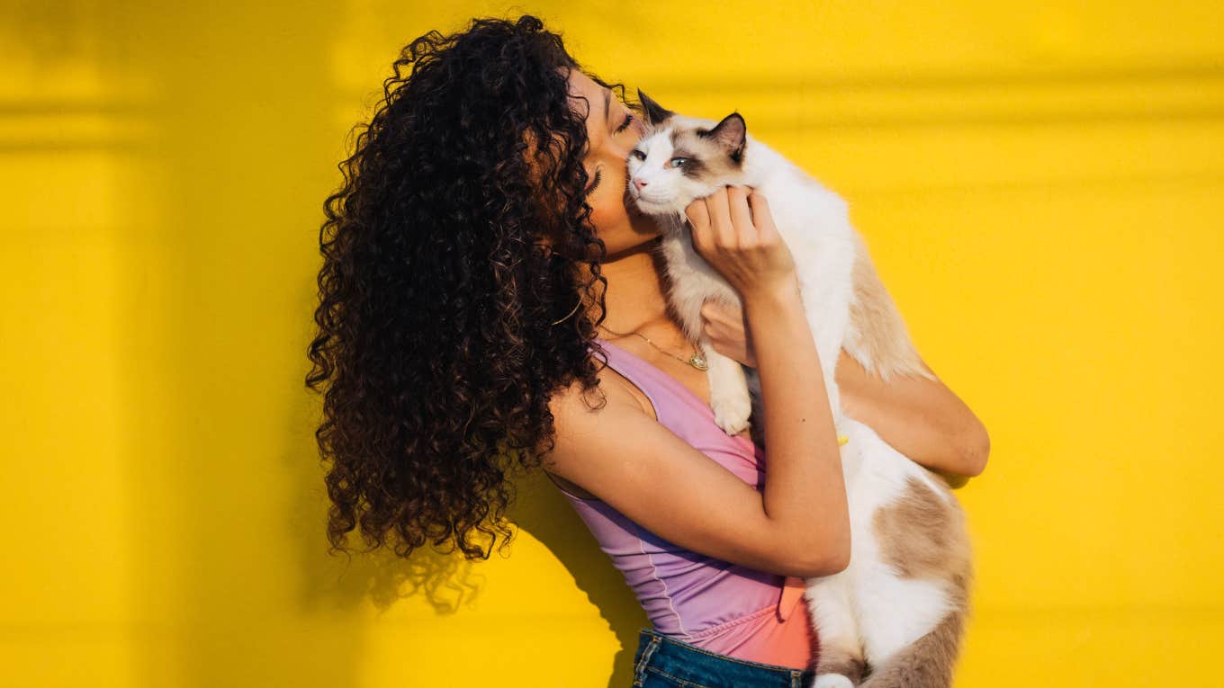 woman holding a cat 