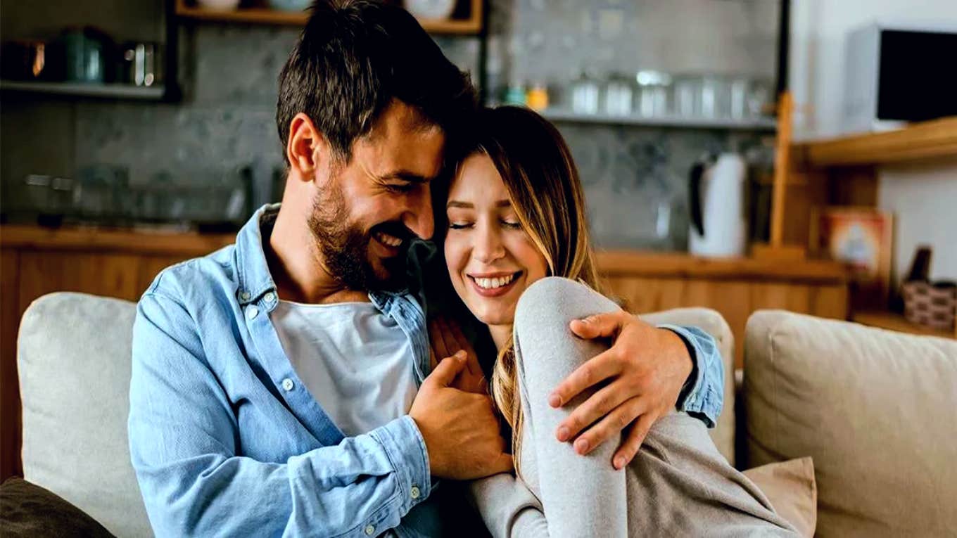 couple smiling on the couch