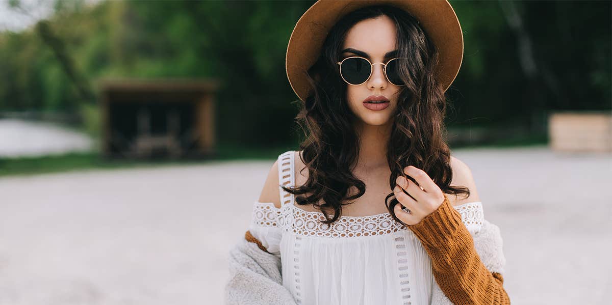 fashionable woman in hat and sunglasses