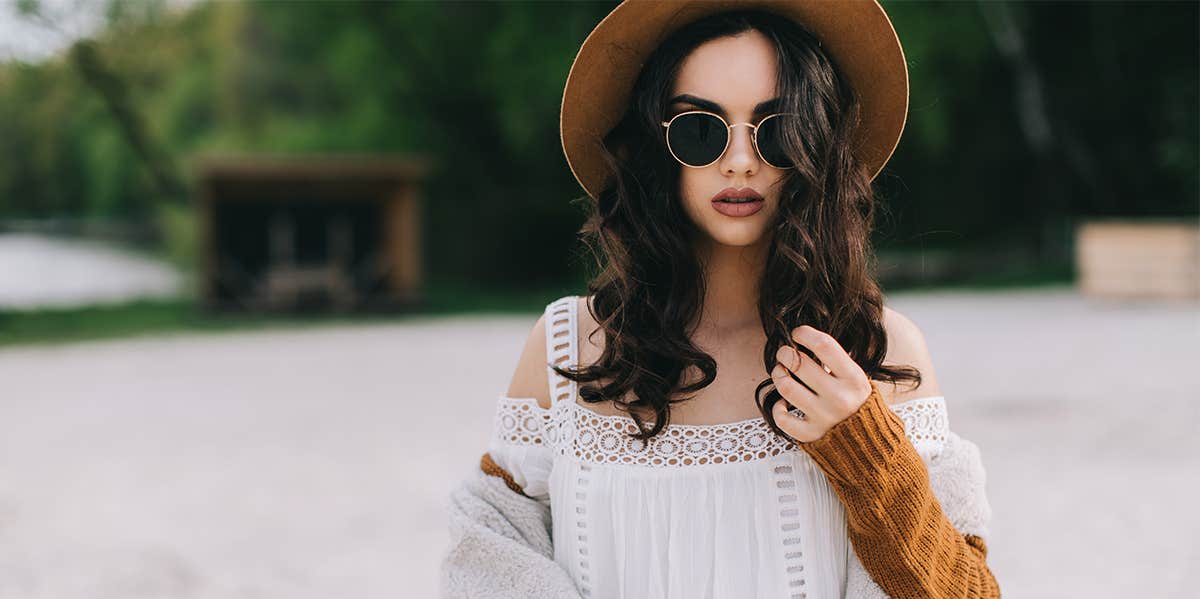 What Your Clothes Say About Your Love Life fashionable woman in hat and sunglasses