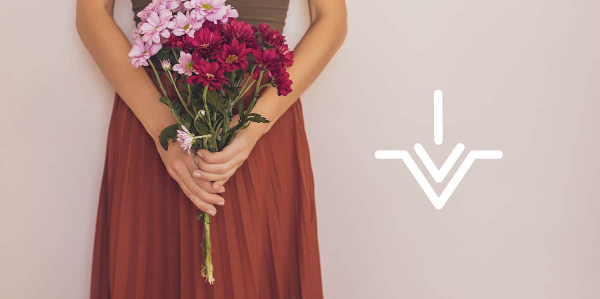 woman holding bouquet of flowers