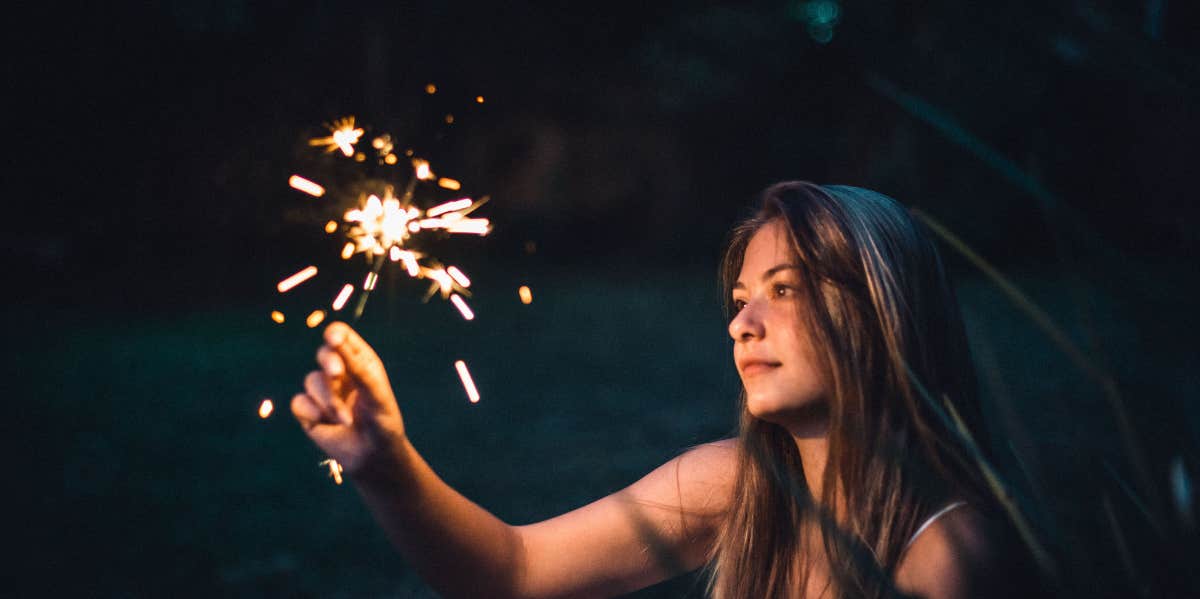 woman holding sparkler