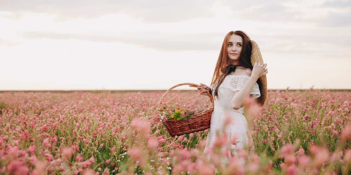 woman holding a basket in garden