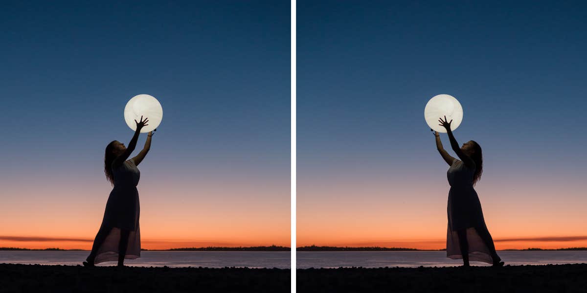 woman holding the full moon