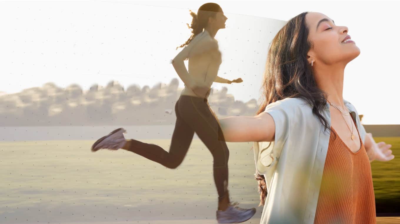 Woman running through desert, rejoicing in happiness