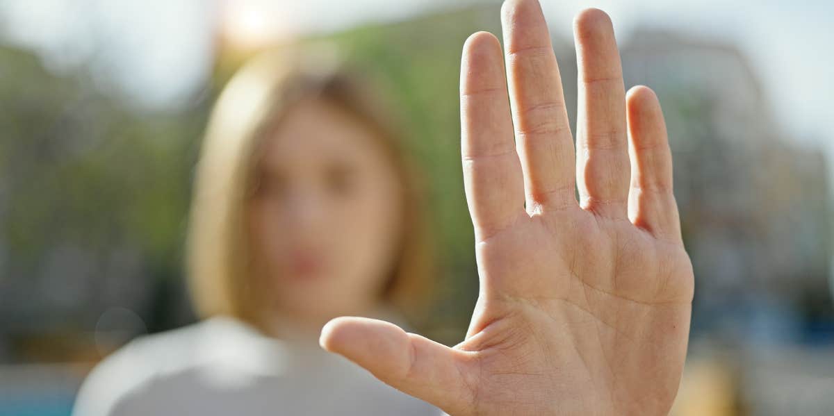 woman holding up her hand