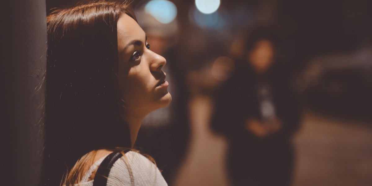 sad woman outside waiting