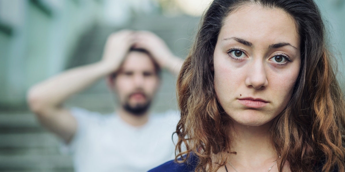 9 Signs It's Time To Call It Quits On Your Relationship upset woman with distressed man behind her