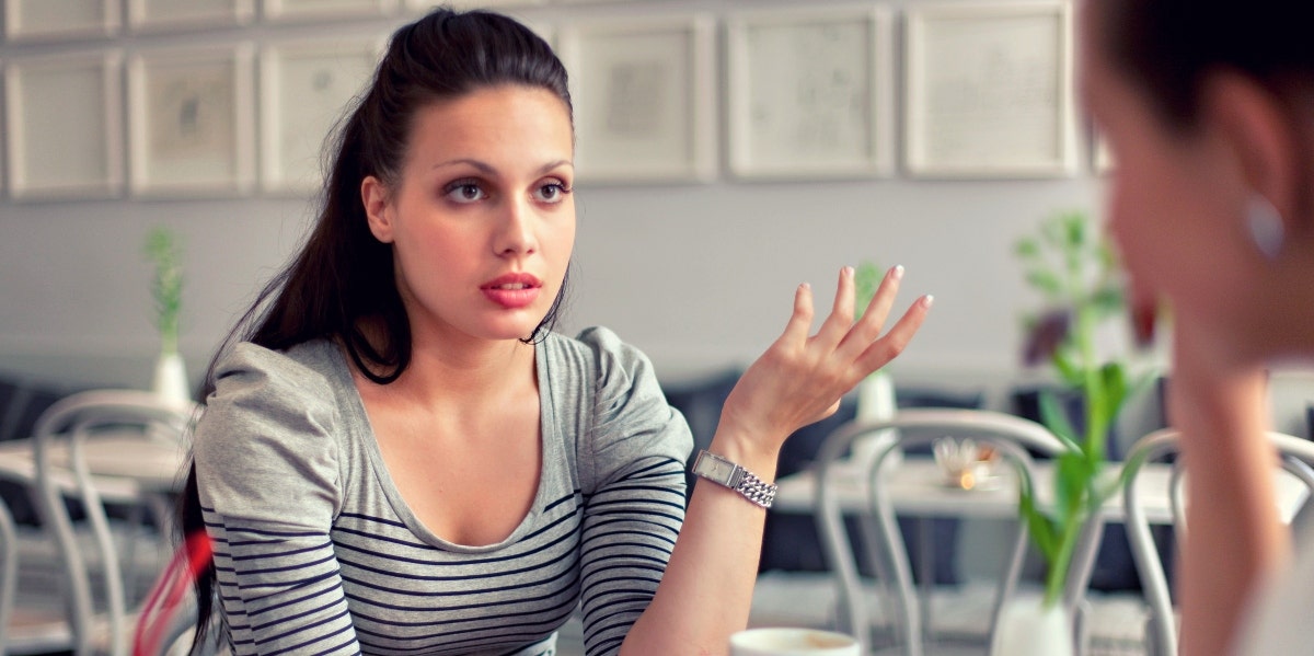 woman sitting at a table with friend