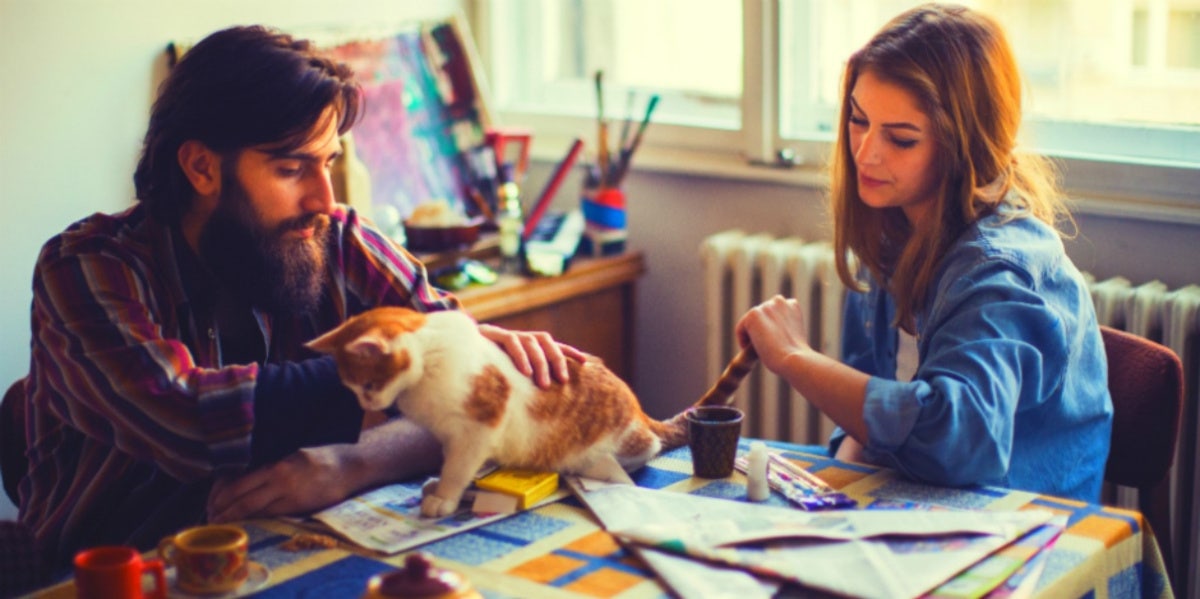 husband and wife with cat