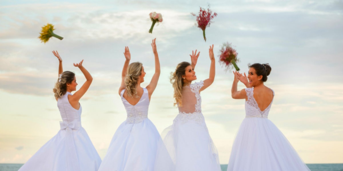 brides throwing bouquets in air