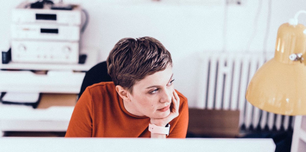 woman at a desk looking away