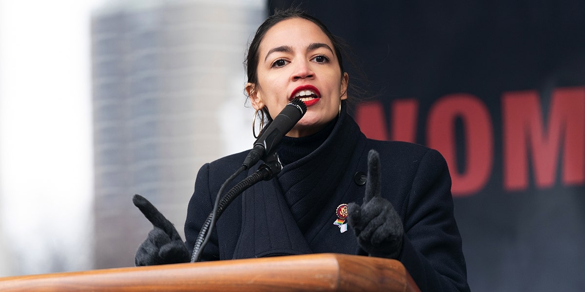 alexandria ocasio cortez speaking at podium