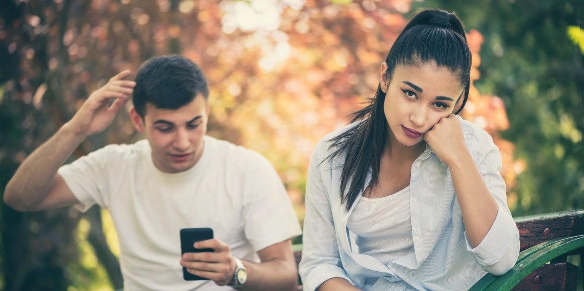 frustrated woman with man behind her