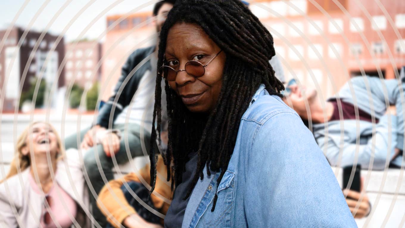Whoopi Goldberg with millennials in background