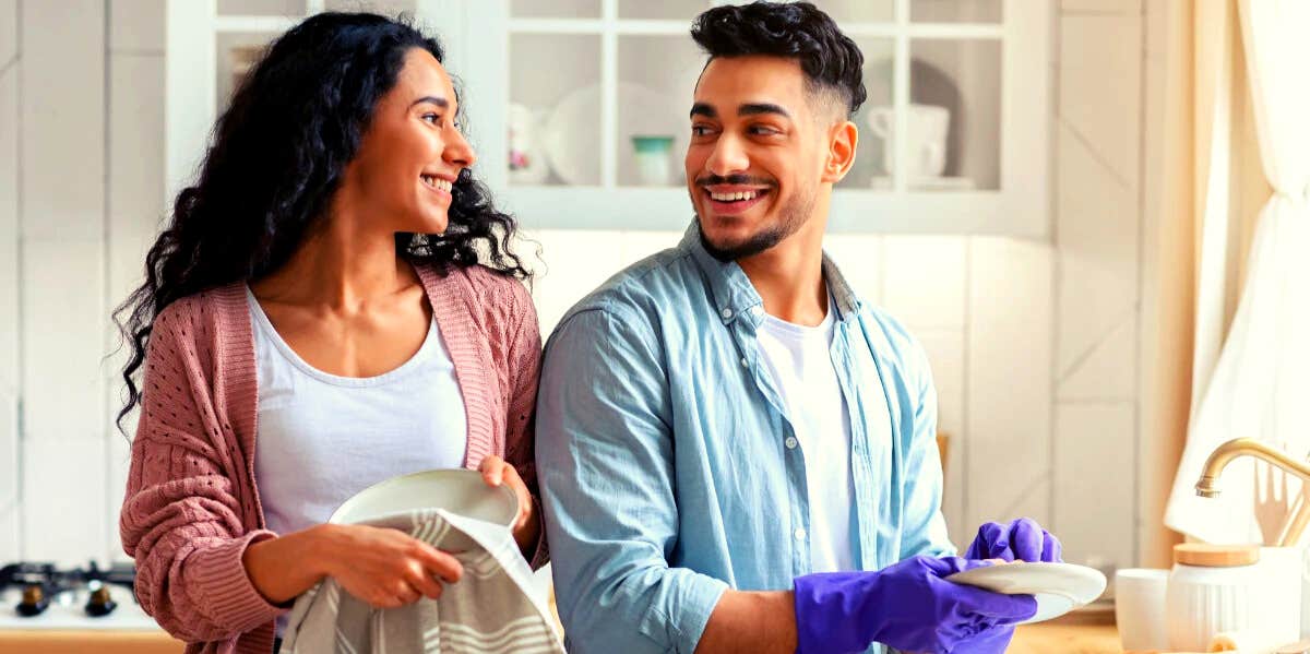 couple washing dishes together