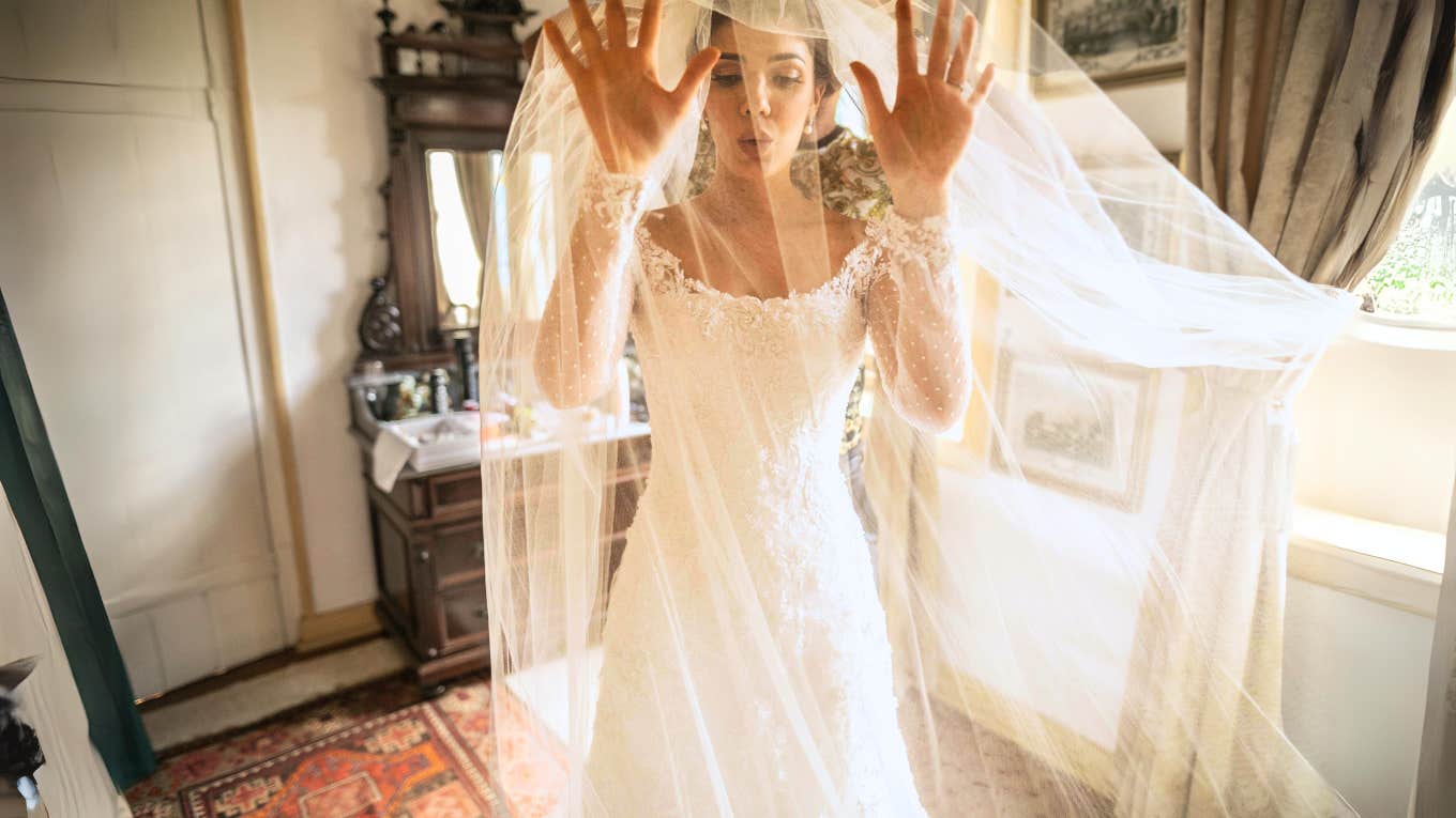 Woman in wedding dress, terrified of marriage, deep breathing