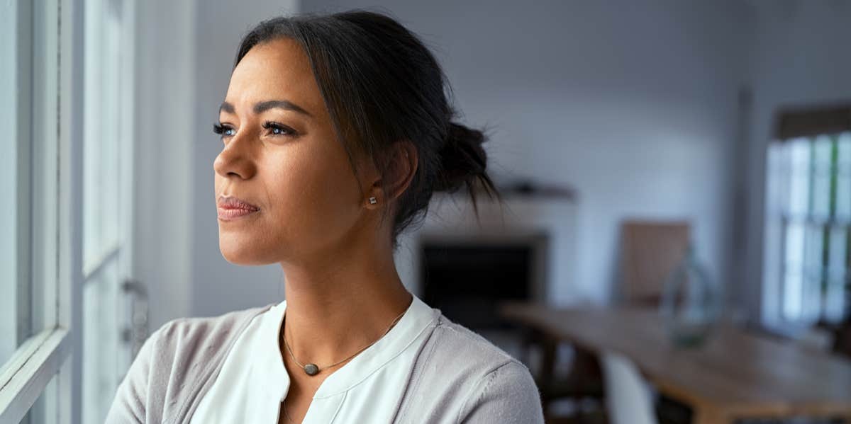 Why Are People Selfish? 10 Reasons For Selfish Behavior woman looking out the window
