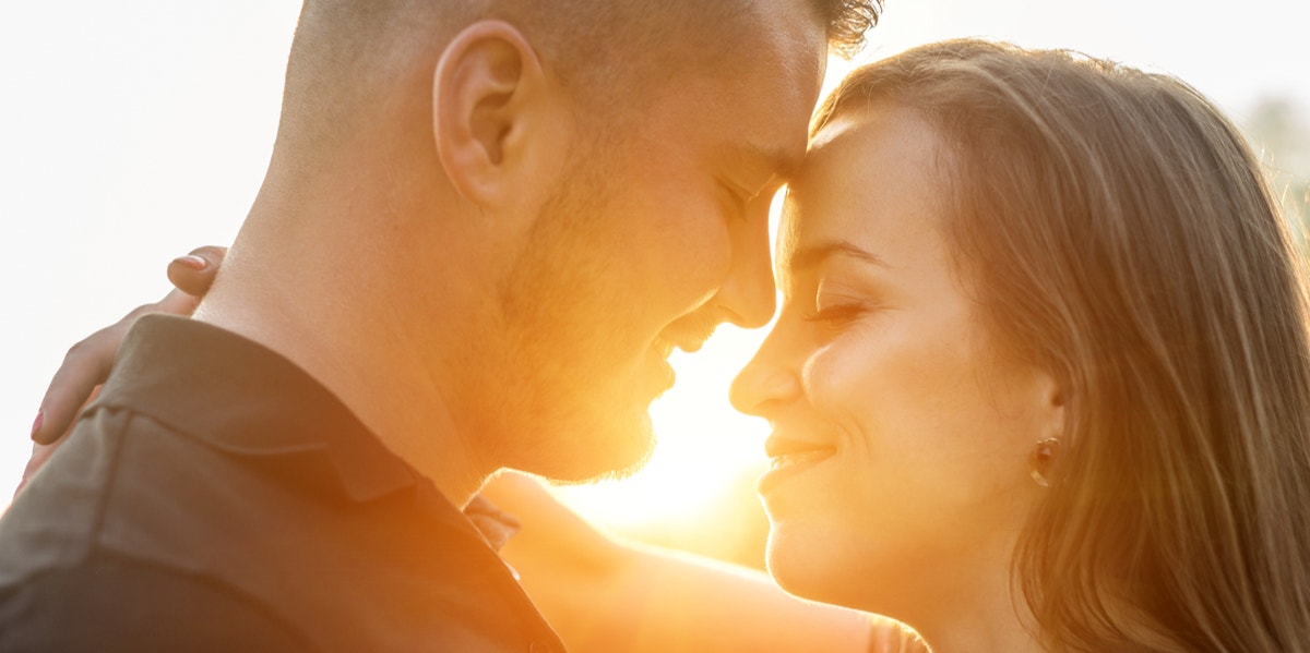 man and woman kissing