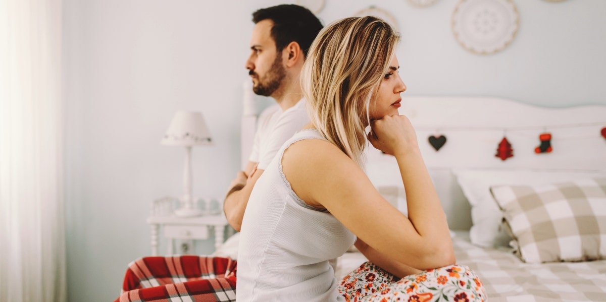 upset couple in bed