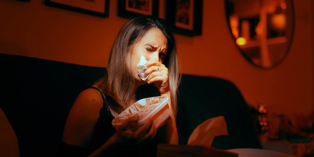 sad woman crying on couch