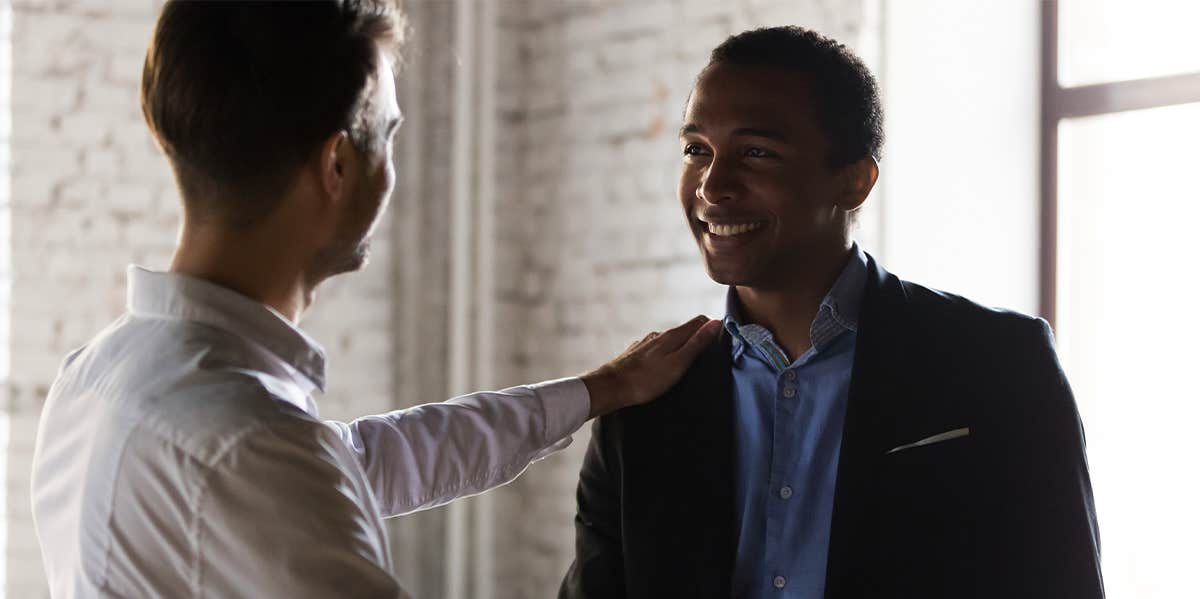 two men talking at work