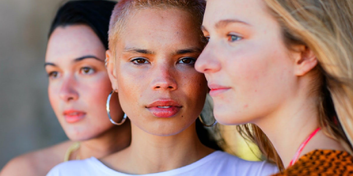 three women, two in profile, one looking ahead