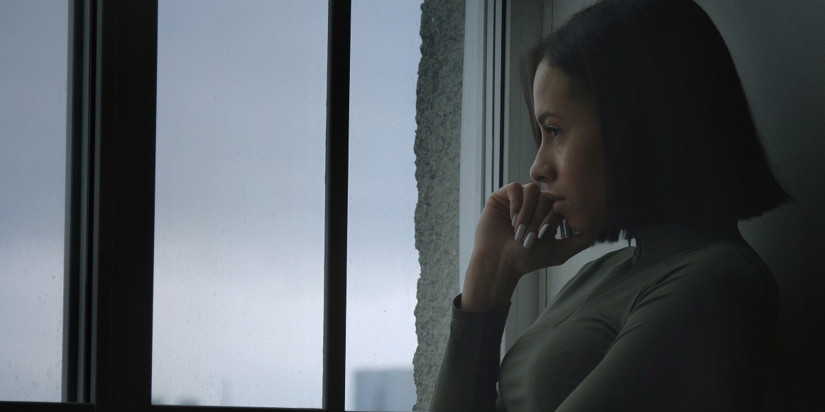 Why Bad Things Happen To Good People & How To Persevere upset woman looking out a window