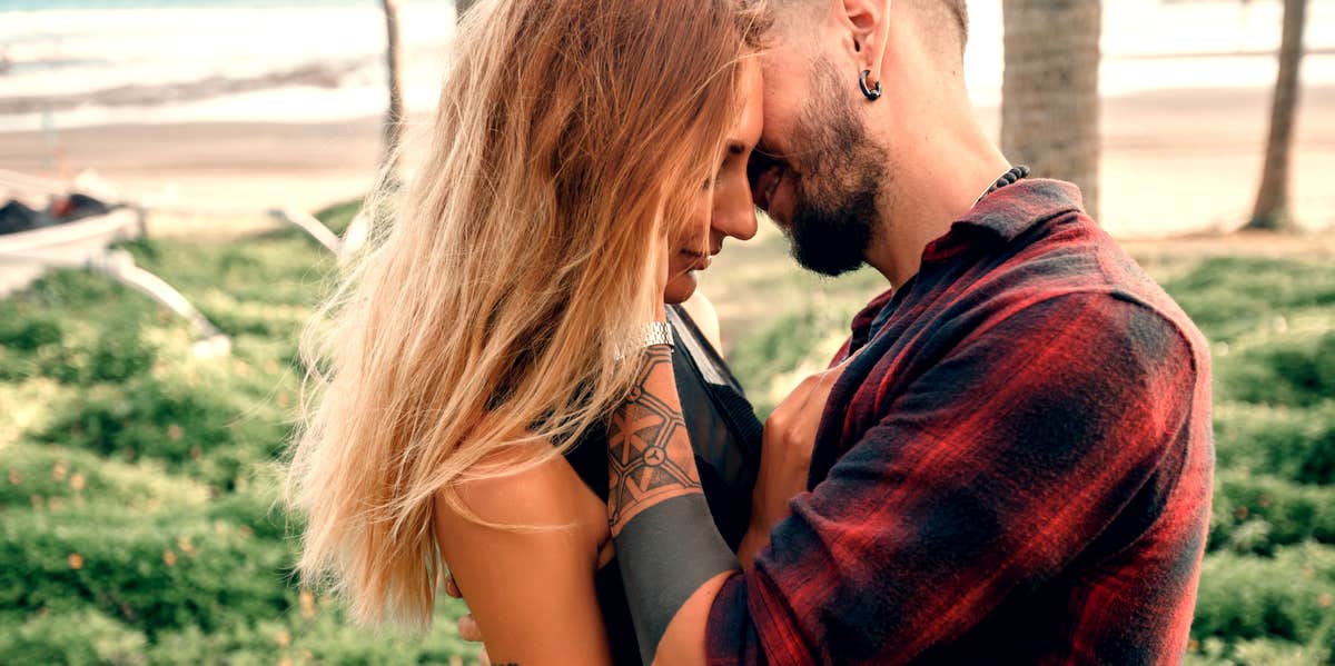 4 Reasons You Fall For The Same Type Of Guy Over And Over Again couple embracing