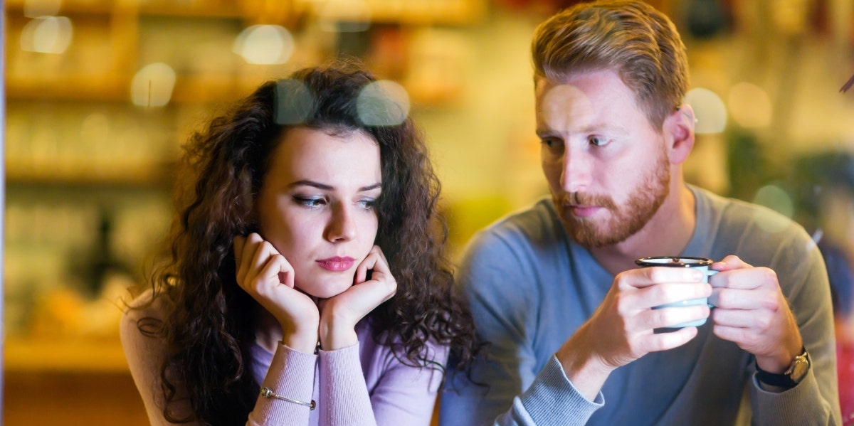 man looking at sad woman 