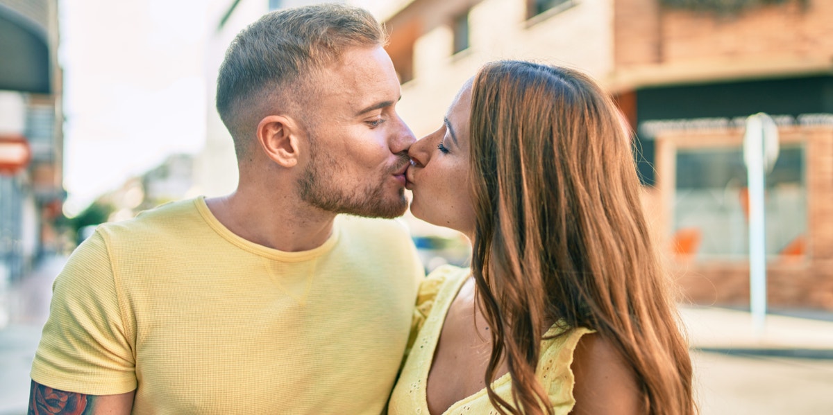 man and woman kissing