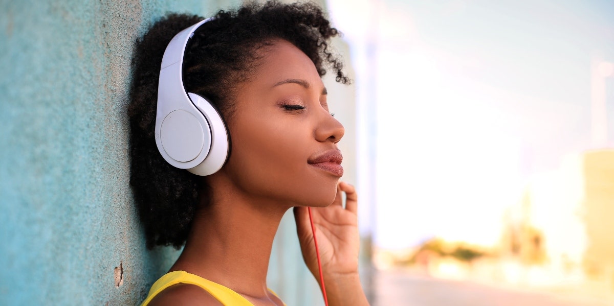 why do songs get stuck in your head woman listening to music