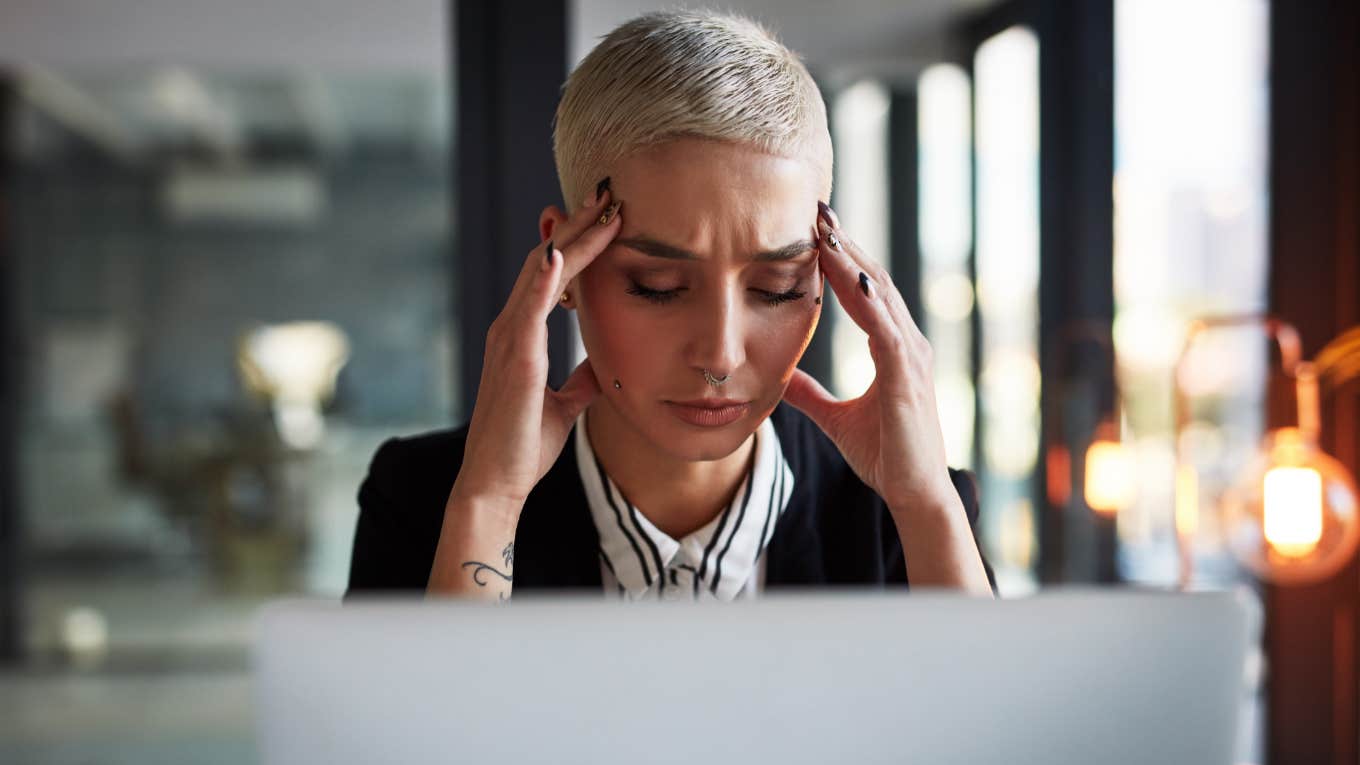 woman stressed and struggling to focus at work