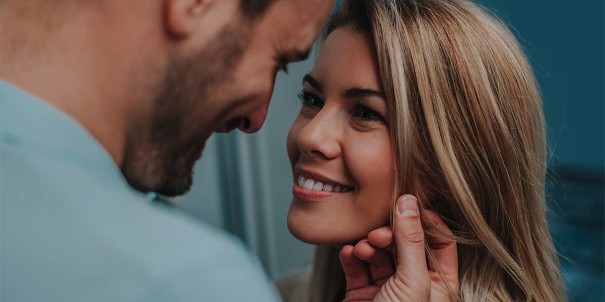 Why I Can't Stand When A Guy Tells Me To 'Give Him A Smile' man making woman smile