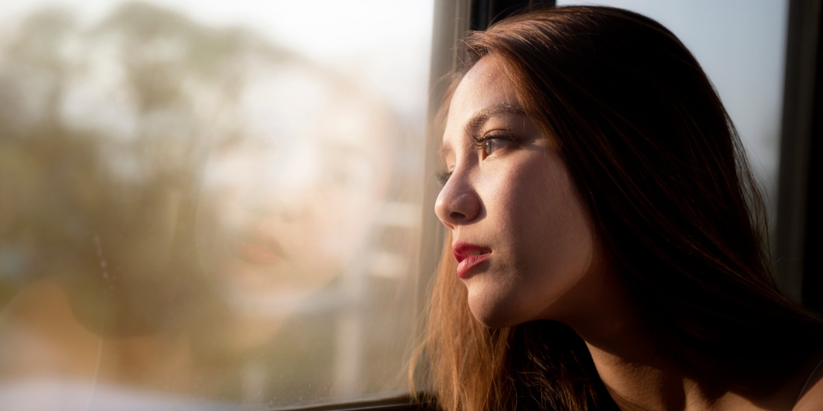 woman looking out the window