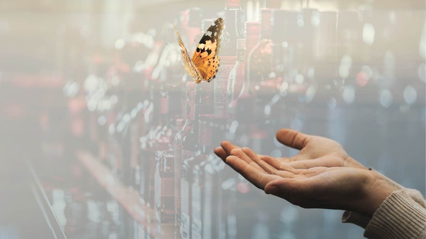 Why I No Longer Call Myself An Alcoholic Woman letting go of butterfly, liquor behind her no longer controlling