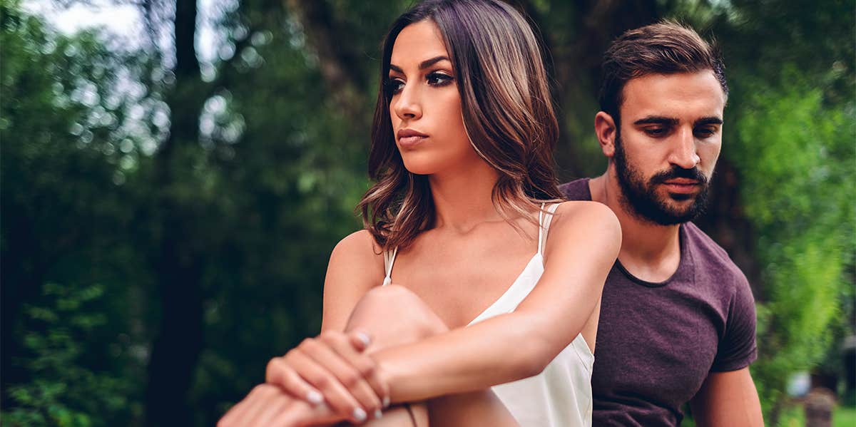 Why I Stayed When My Boyfriend Cheated On Me unhappy couple sitting together