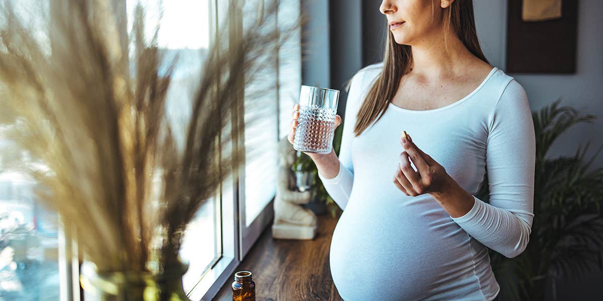 pregnant woman taking pill