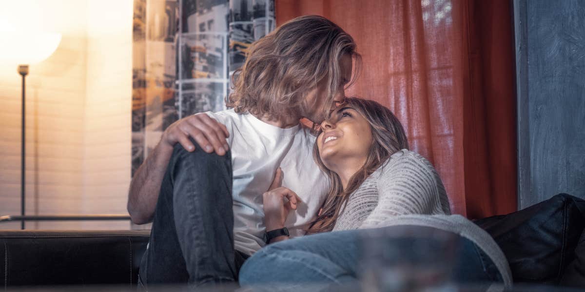 couple cuddling on couch