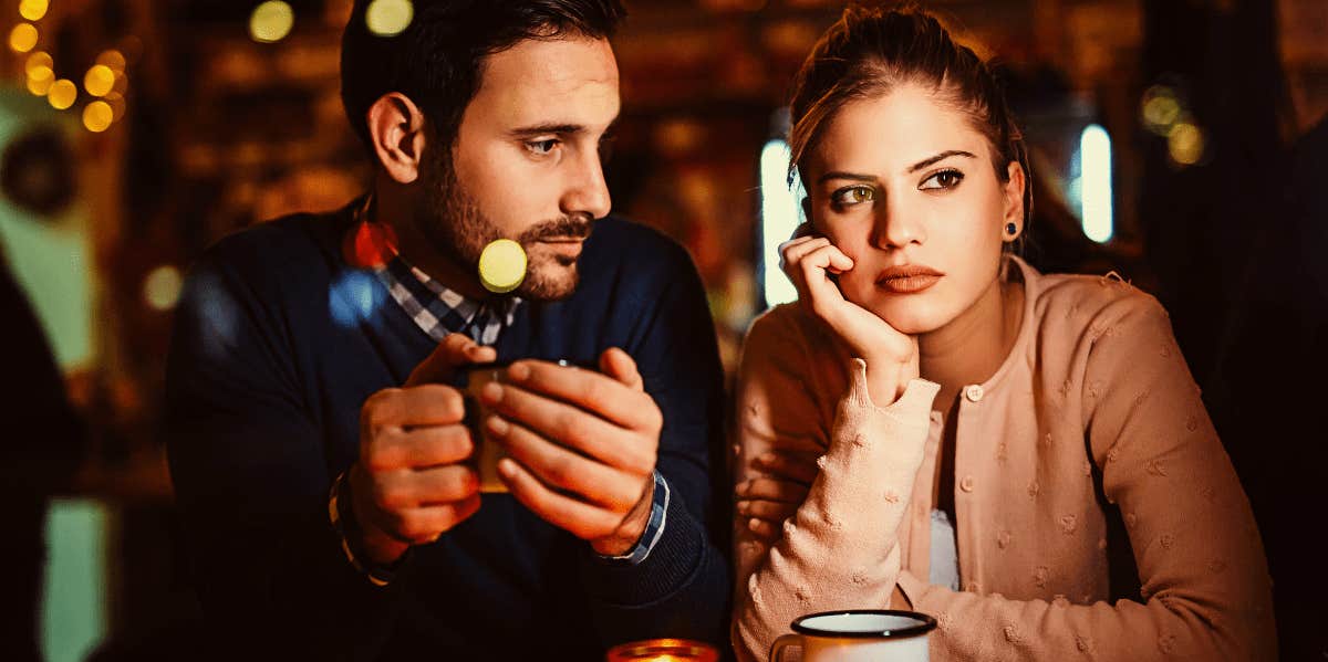 Why It's So Hard To Break Up With Someone Even If You Don't Love Them man looking at woman who wants to break up with him