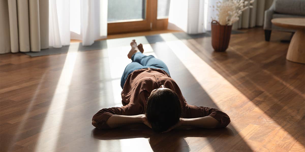 woman laying on floor