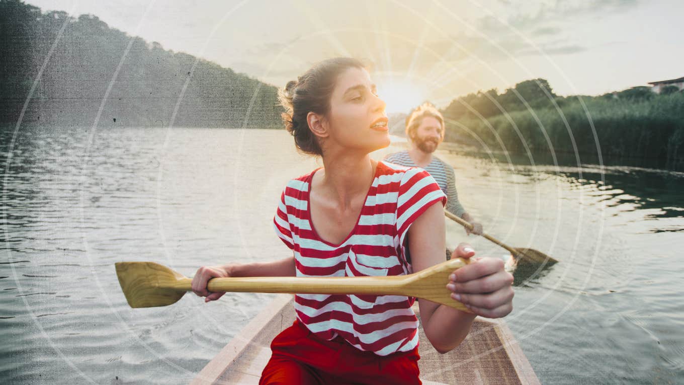 Couple on an adventure together in canoe 