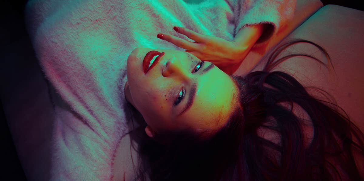 Why Married Men And Women Stray: Top 3 Reasons For Each woman seductively laying on bed