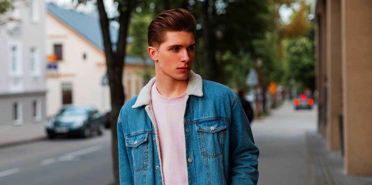 man walking down street