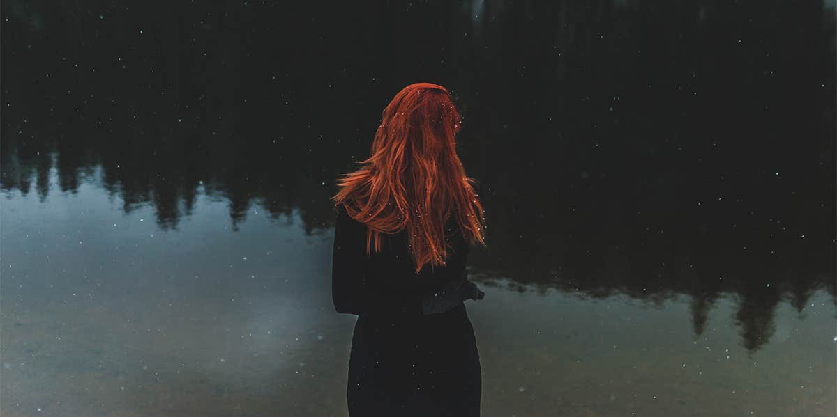 woman looking at lake