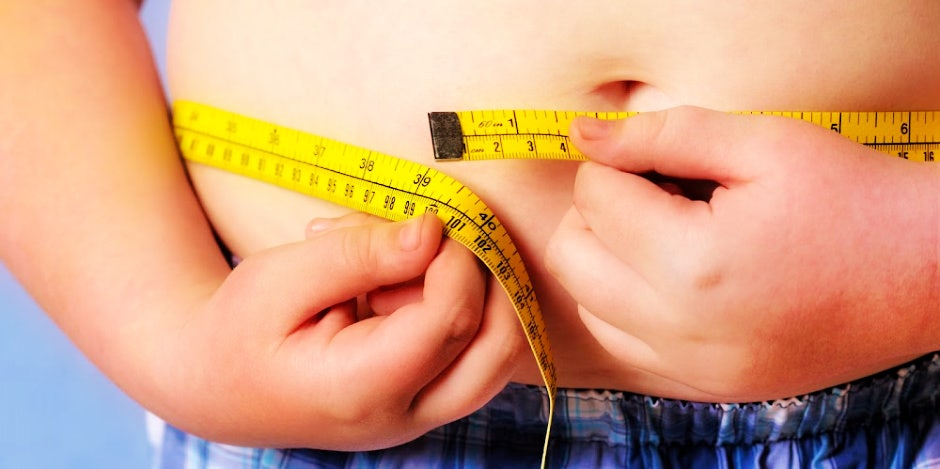 person measuring stomach
