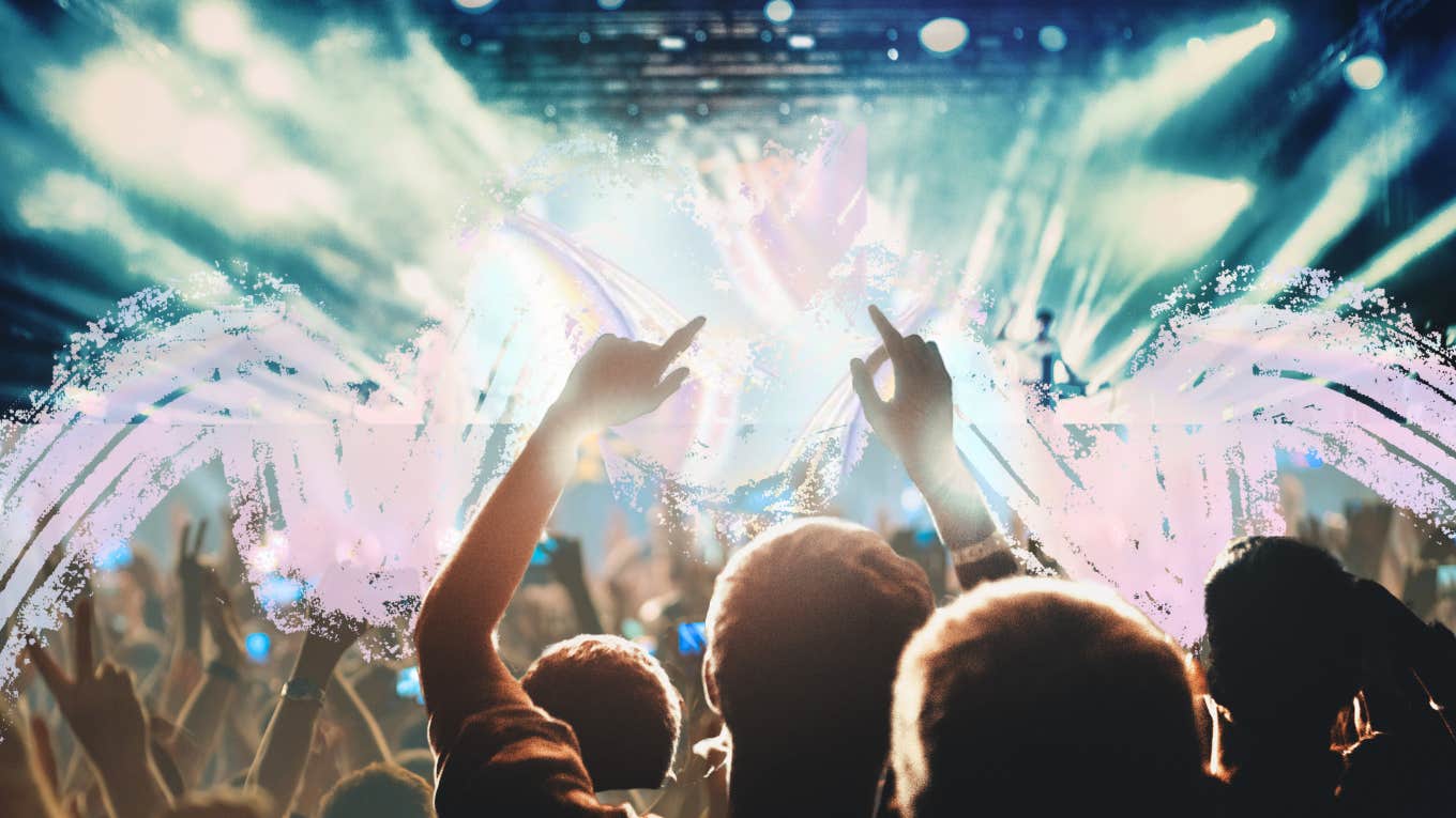 Why People Who Record Everything Are A Problem People at a concert with their phones out recording, man in the middle living in the moment