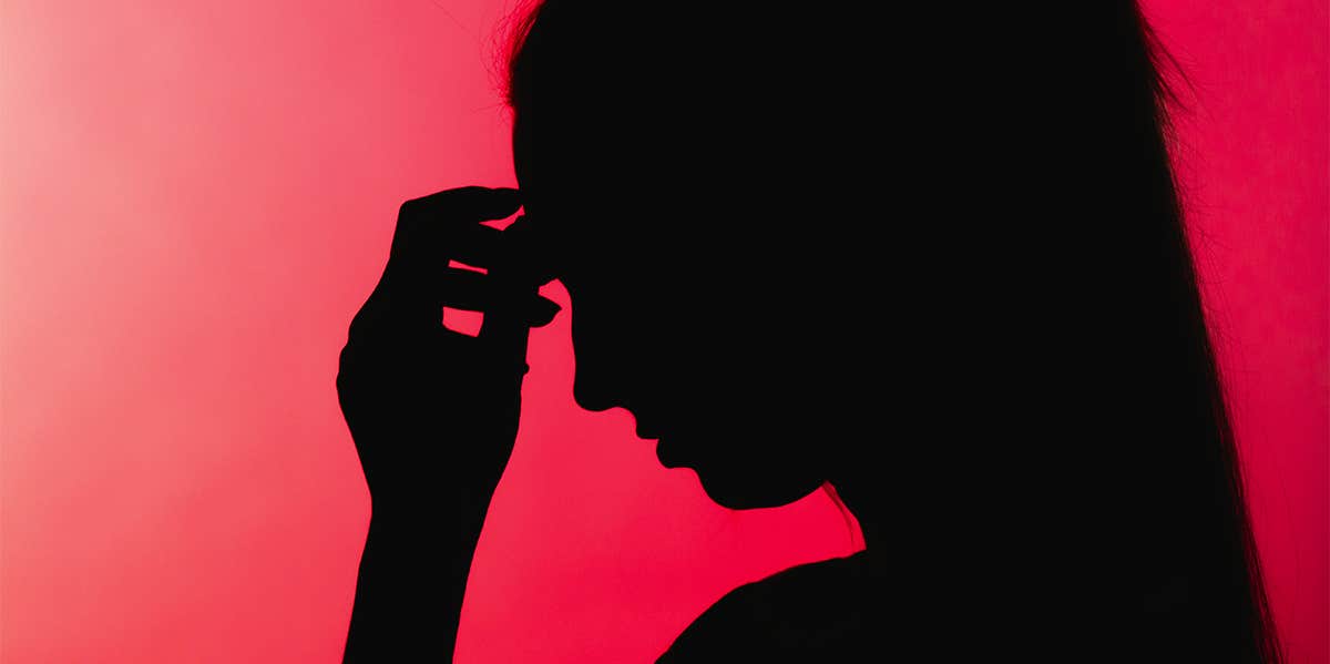 stressed woman against red background